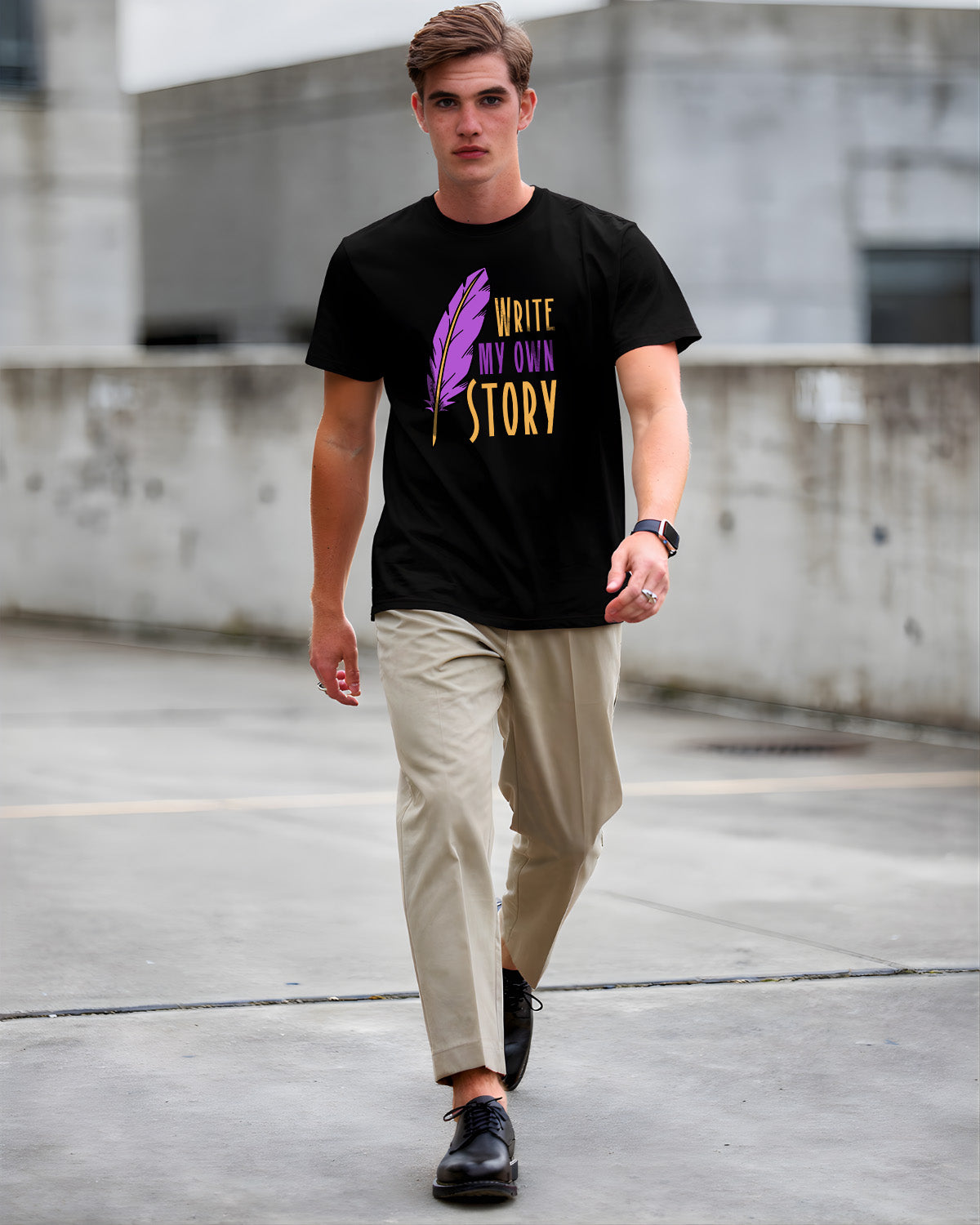 Man wearing a black t-shirt with a motivational quote, walking on a concrete surface.